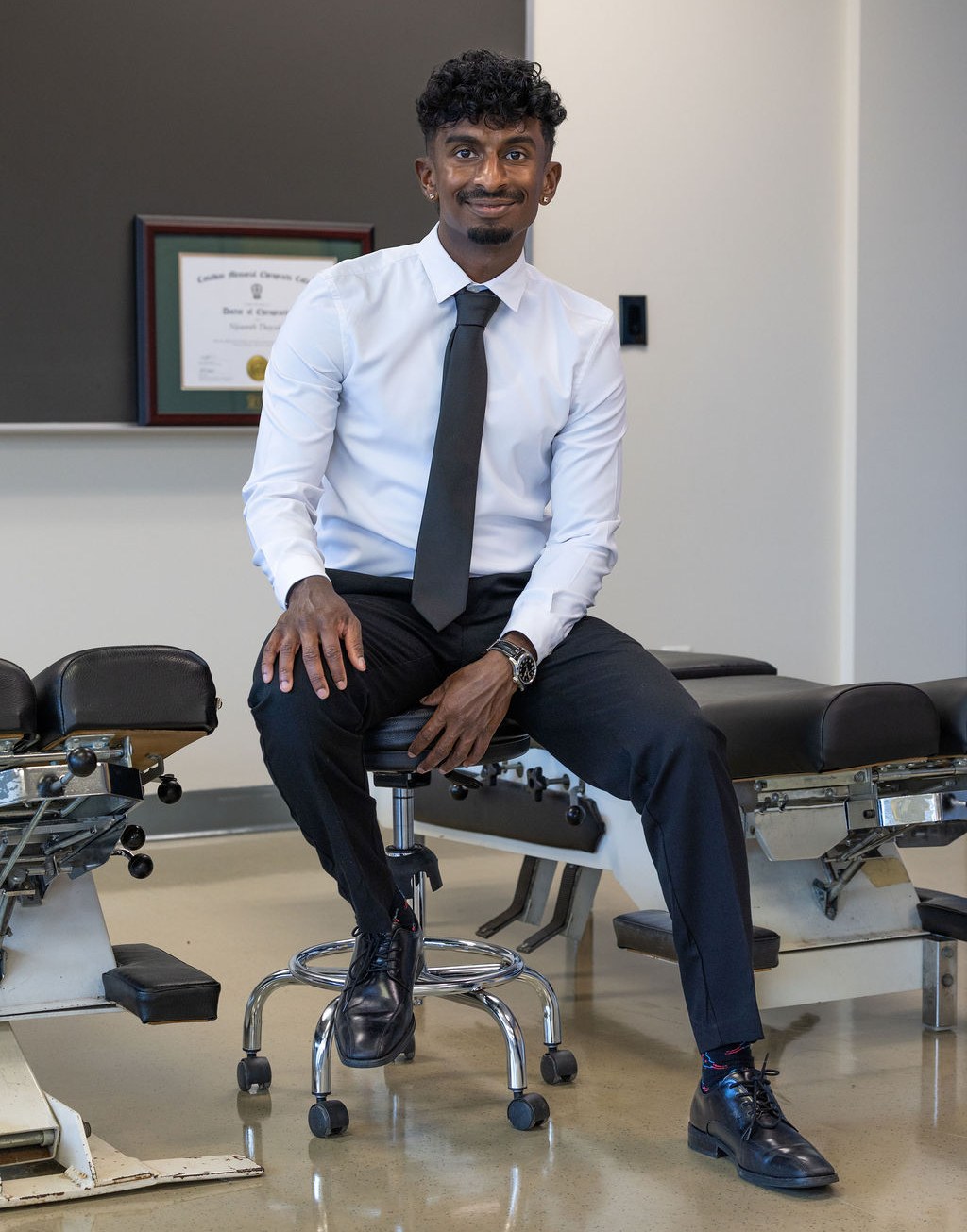 Dr. Nijaanth Thayalan, chiropractor and founder of Corporate Chiro