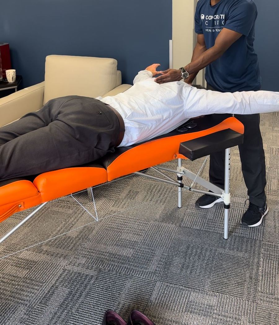 On-site treatment on a portable table in a client's office lounge